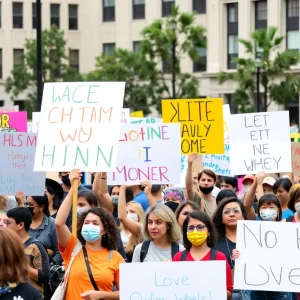 Participants at the Lexington community rally holding signs for unity and justice.