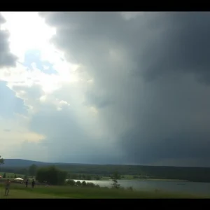 Landscape of Central and Eastern Kentucky showing sunny skies with storm clouds approaching.