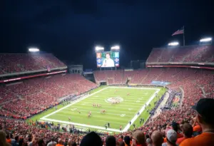 Crowd at college football game with scoreboard