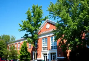 School building in Lexington, Kentucky with trees and clear sky