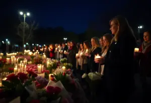 Community members holding candles at Lexington Vigil for Transgender Day of Remembrance