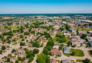 Aerial view of neighborhoods in Owensboro, Kentucky with houses and green parks.