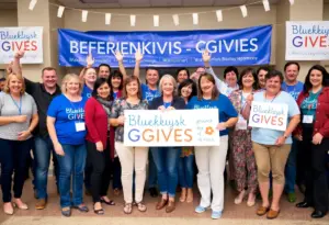 A diverse group of people celebrating at Bluegrass Gives fundraising event