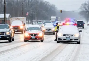 Police assisting drivers in snowy conditions in Lexington