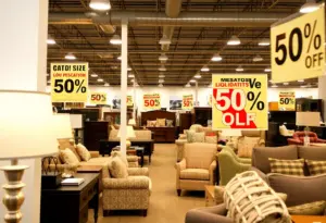 Interior view of Value City Furniture during liquidation sale with discounts